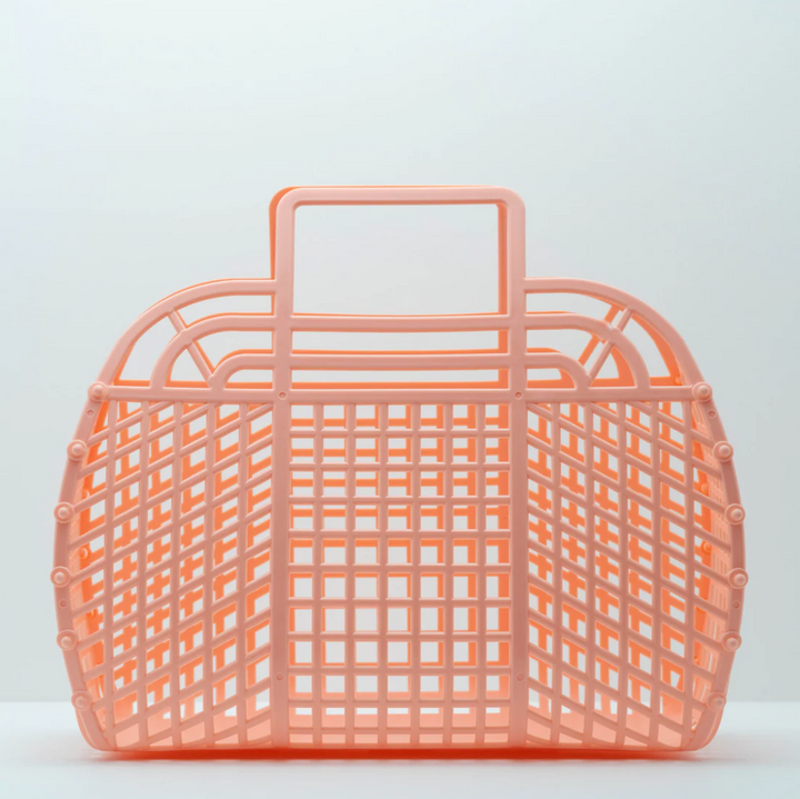 A large, vintage-style peach jelly basket against a white background.