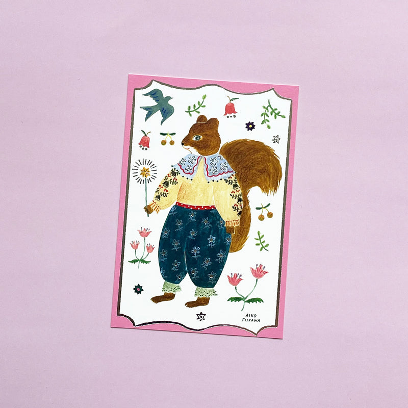 This postcard has a pink border around a white background with nature images. A anthropomorphic squirrel in a beautiful top and trousers holds a magic wand in the middle.