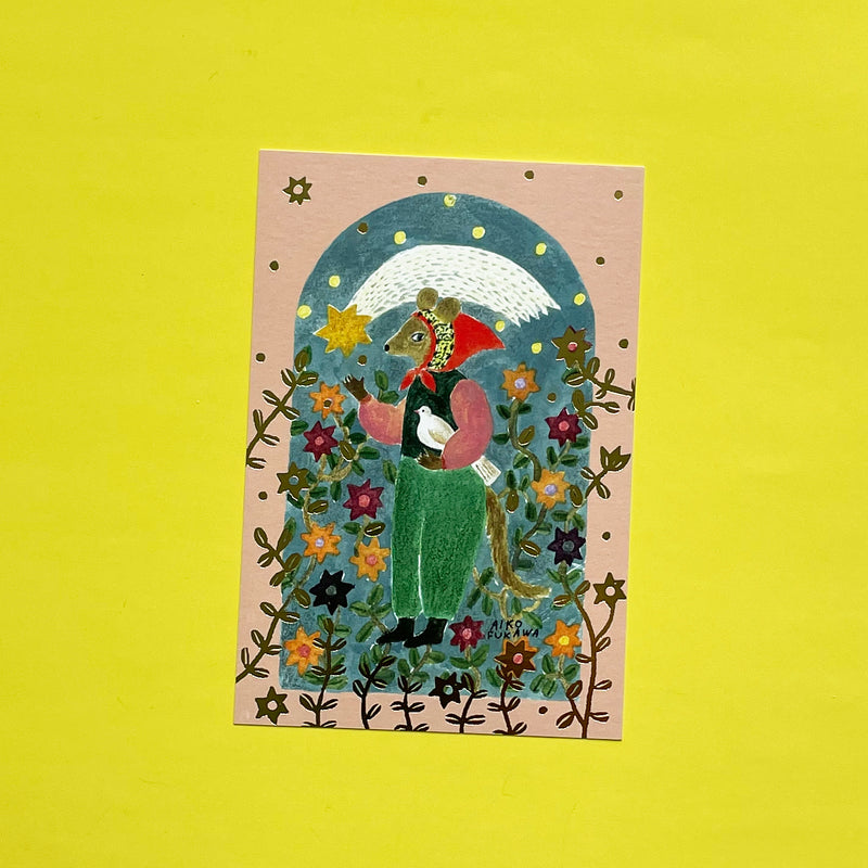 A mauve post card with an anthropomorphic mouse in a red bonnet holding a dove under a shooting star. Gold vines and flowers surround the character.