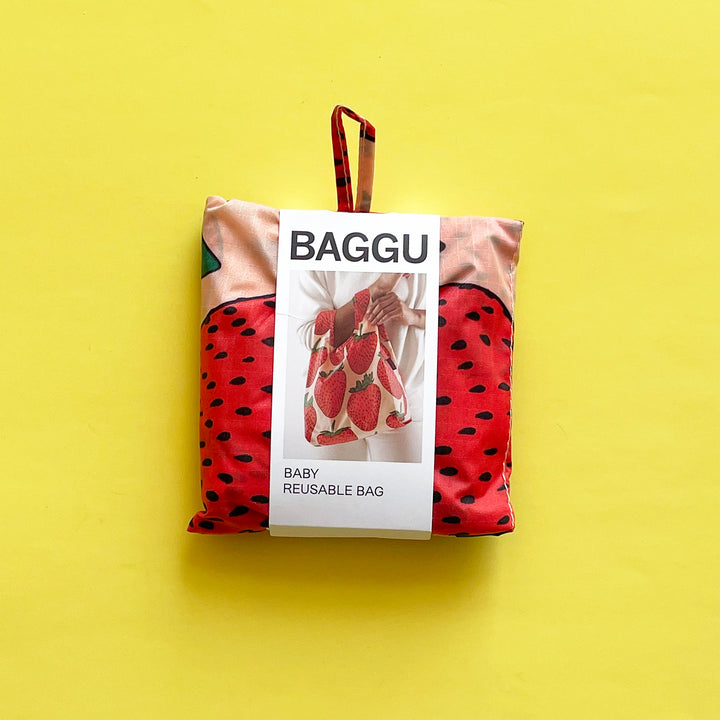 Classic Strawberry bag on yellow background.