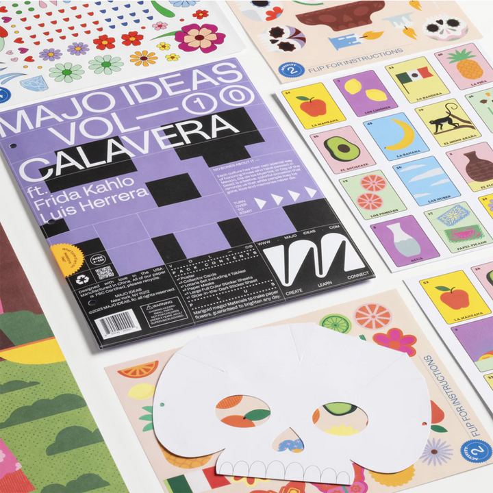 Contents of the Majo Ideas Calavera Activity Kit laid out. Includes Lotteria game and mask decorating.