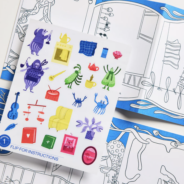 Process photo of a sticker activity from Majo Ideas Home Activity Kit, Includes a sticker sheet with cartoon drawings of bugs and typical household items.