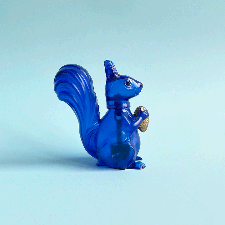 Translucent blue squirrel bobblehead figurine bobbing it's head back and forth.