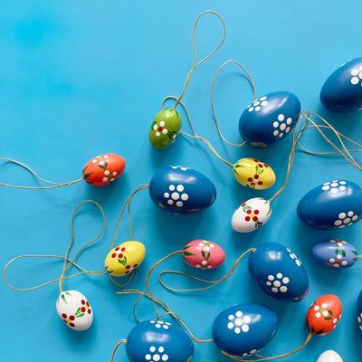 Several colorful shaped ornaments  on a blue background. 