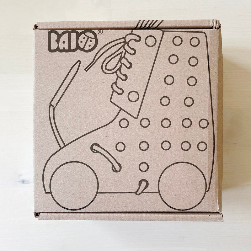 Cardboard box with an illustration of a lacing rollerskate.
