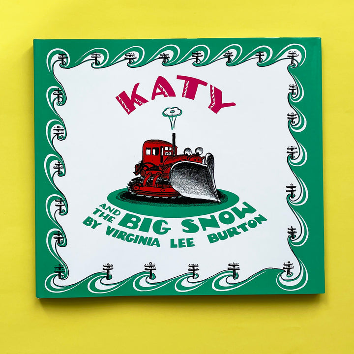 A copy of the book "Katy and the Big Snow". The cover featured an illustration of a red tractor with green, white and black accents. 