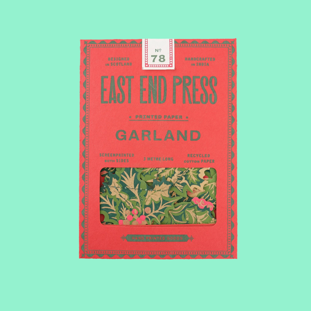 Red book titled 'Garland' by East End Press on a light green background