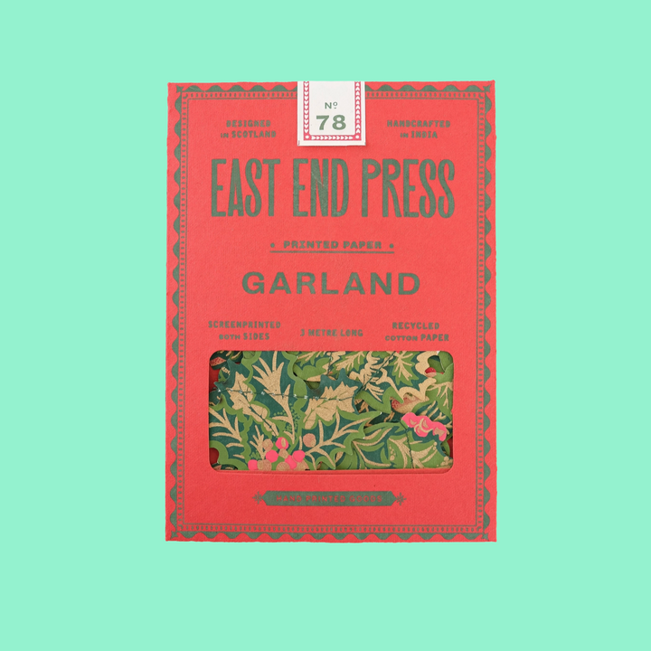 Red book titled 'Garland' by East End Press on a light green background
