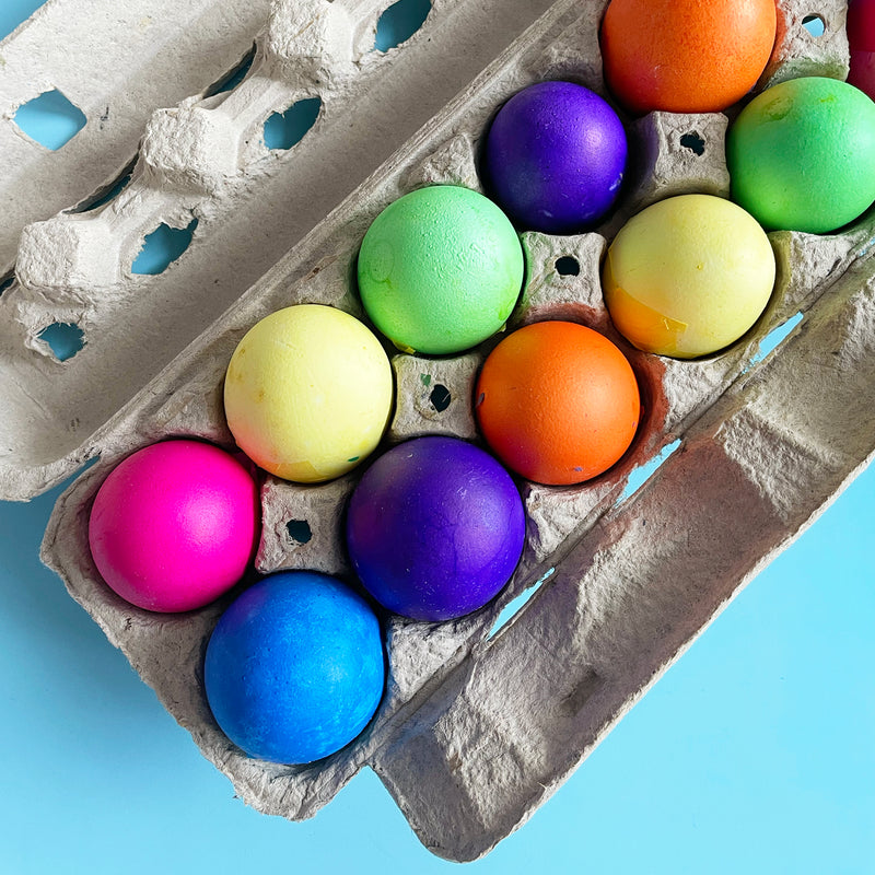 colorful confetti eggs in their paper egg carton