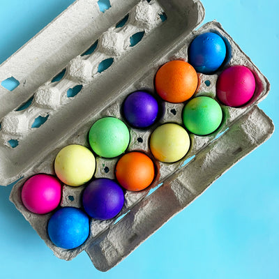 a dozen confetti eggs sitting in their carton