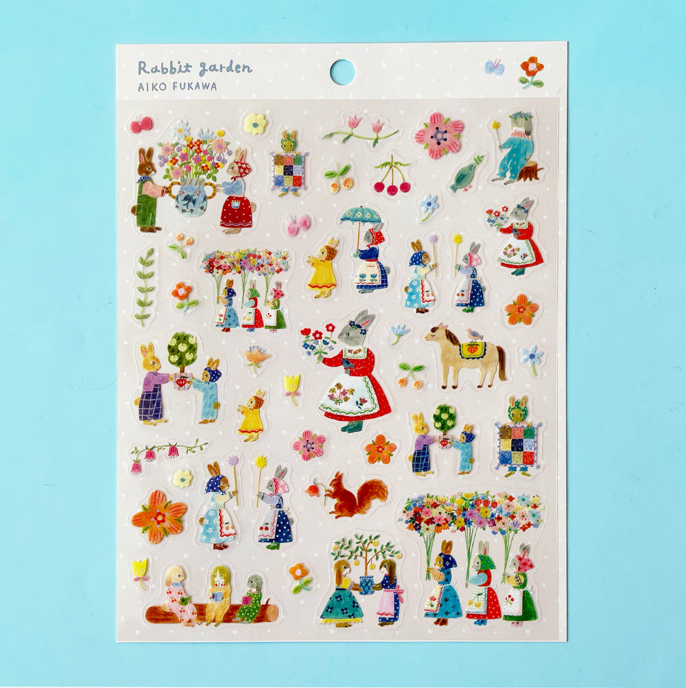 The "Rabbit Garden" sticker sheet featuring stickers of illustrated flowers and anthropomorphic rabbits in beautiful outfits and bonnets.