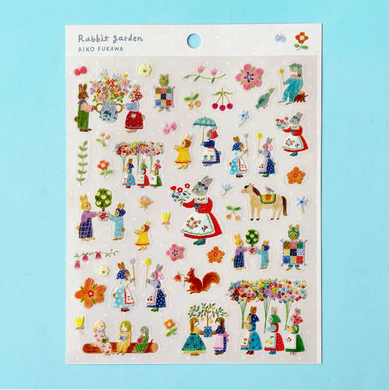 The "Rabbit Garden" sticker sheet featuring stickers of illustrated flowers and anthropomorphic rabbits in beautiful outfits and bonnets.