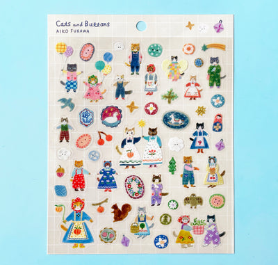 The "Cats and Buttons" sticker sheet featuring illustrated stickers of anthropomorphic cats in dresses, aprons, and overalls, among different beautiful buttons.