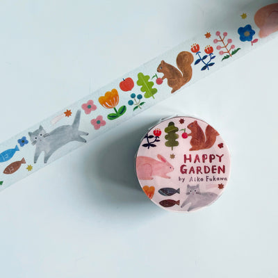 The "Happy Garden" washi tape is translucent with illustrated woodland creatures and cats, berries, stars, and flowers.