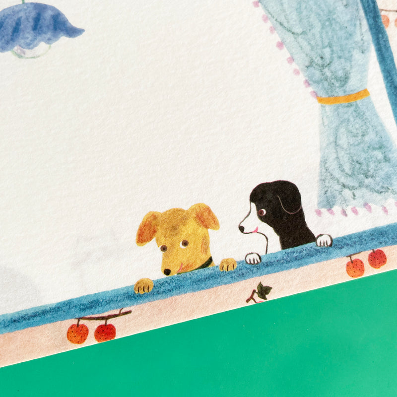 A close up of the two dogs--one yellow one black and white--featured on some of the memo pad pages.