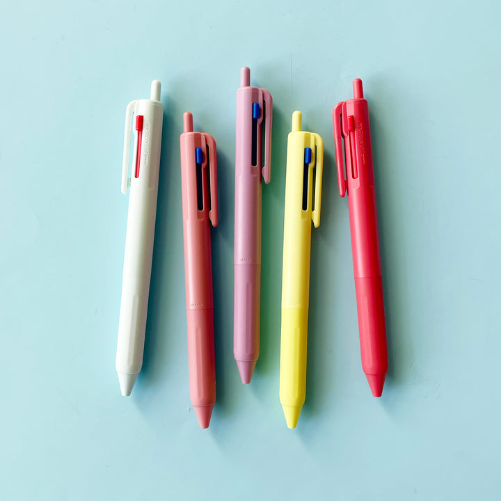 5 different colors of pens on a blue background