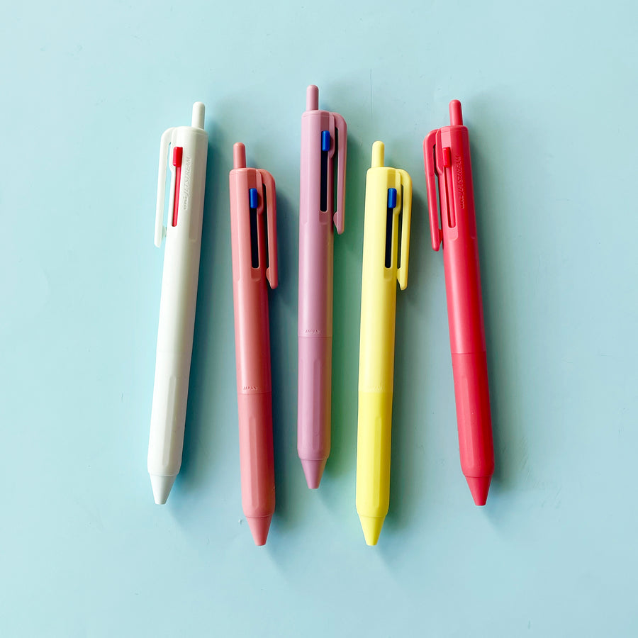 5 different colors of pens on a blue background