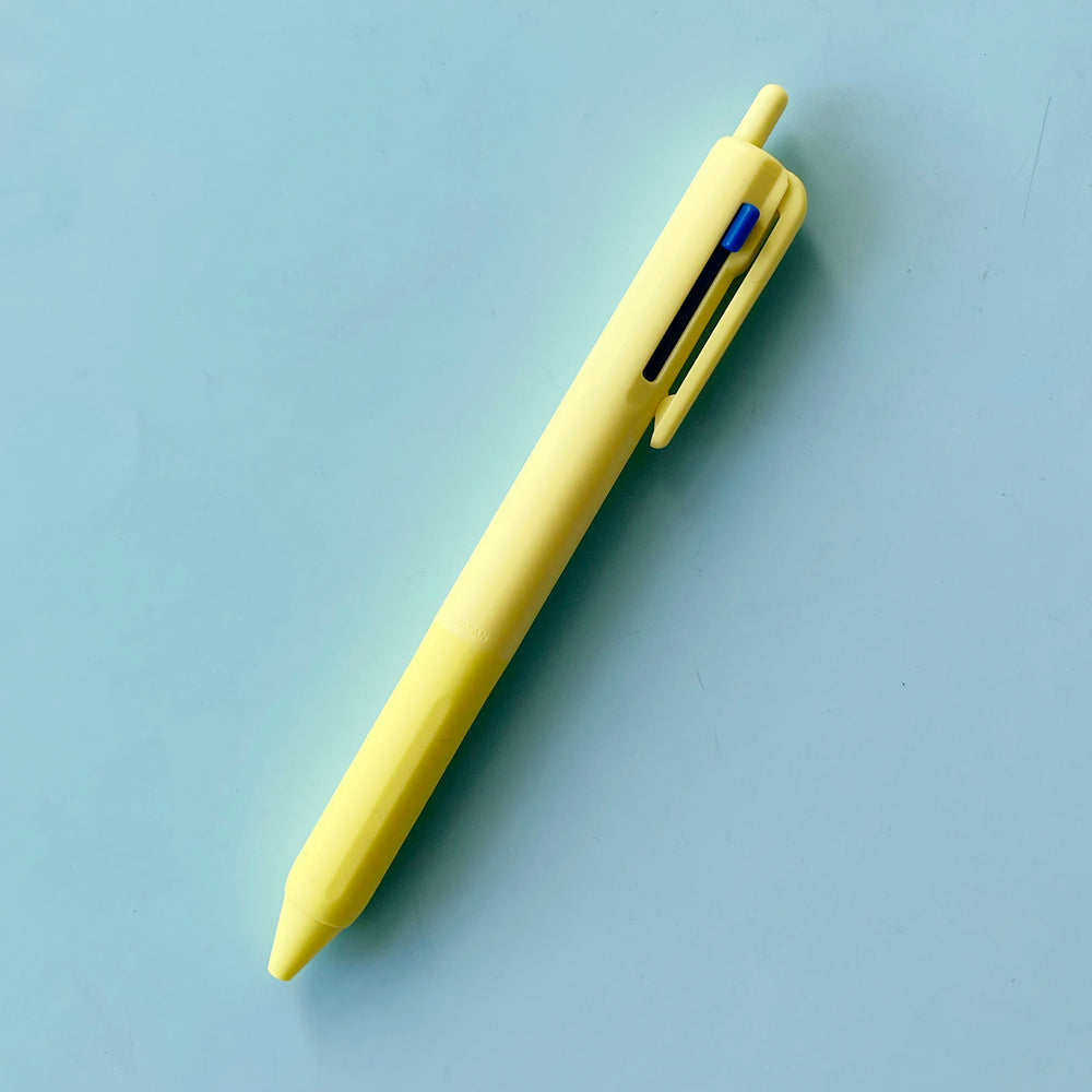 a yellow 3 Color Pen on a blue background