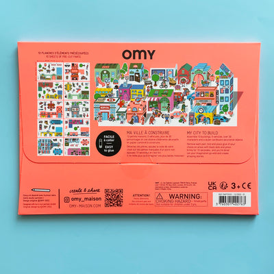 The back of the 3d paper city kit package shows the 10 sheets of pre-cut parts you can assemble into your city with the kit, including a hospital, a depot, and and many characters and vehicles.