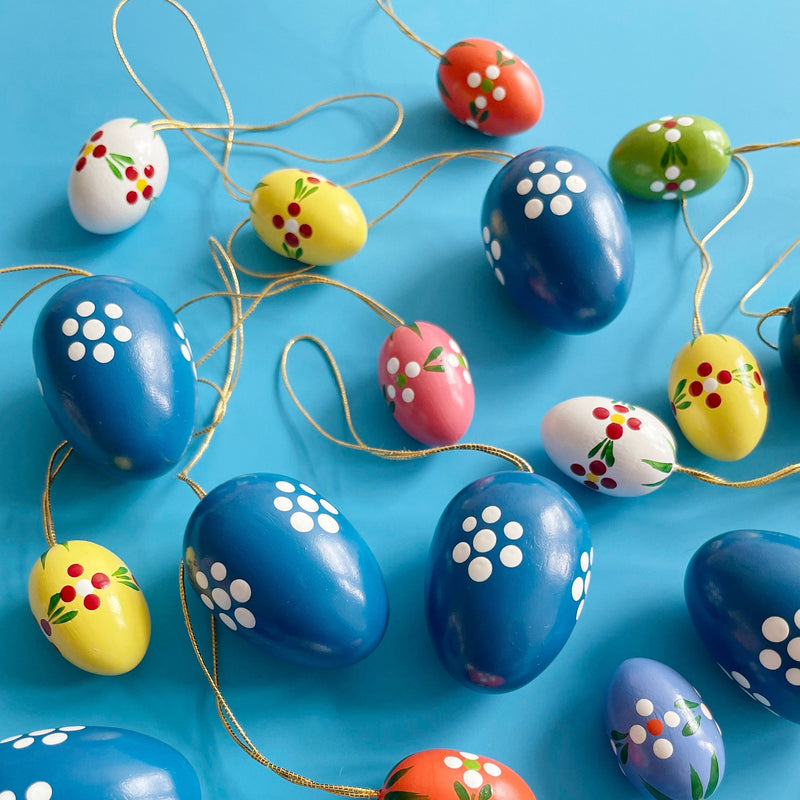 Several colorful shaped ornaments  on a blue background. 