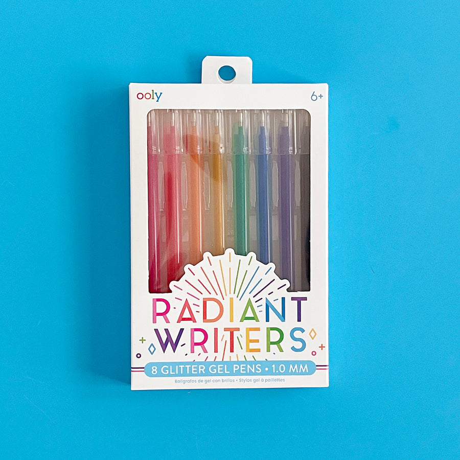 Package of Radiant Writers Glitter Gel Pens by Ooly displayed on a bright blue background. 